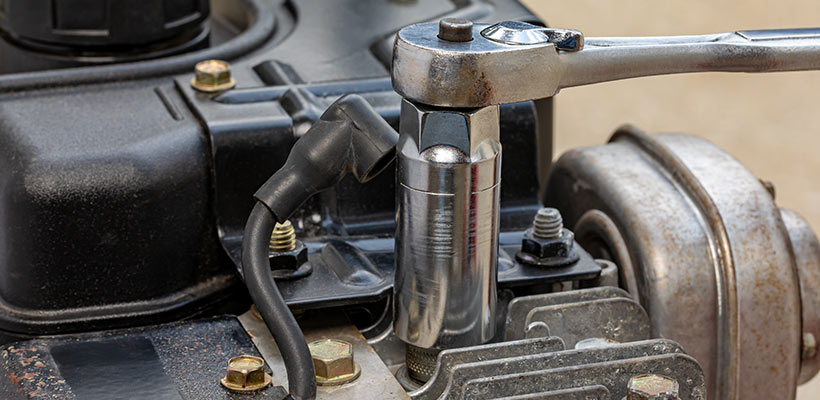 Removing the spark plug.