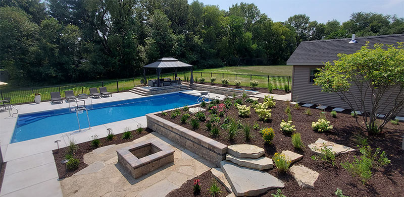 Leveling Up Your Sloped Backyard with an In-Ground Pool Patio