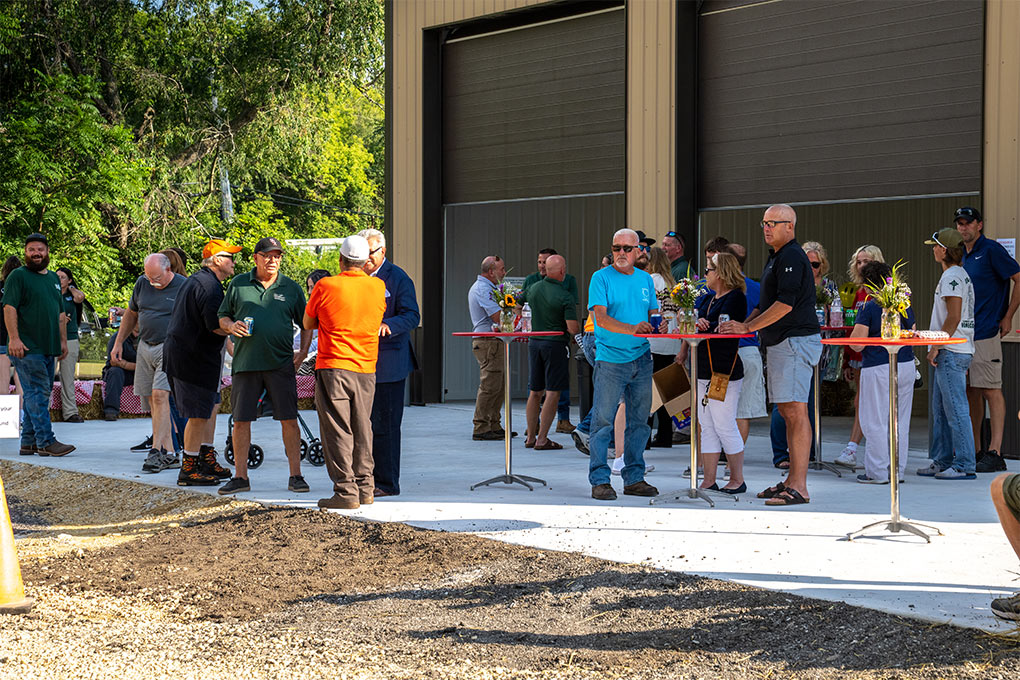 People gathering at the LawnCare By Walter Open House Event