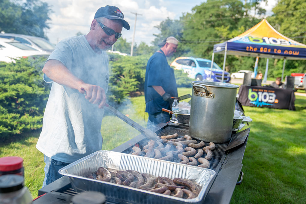 Cooking food at the LawnCare By Walter Open House Event