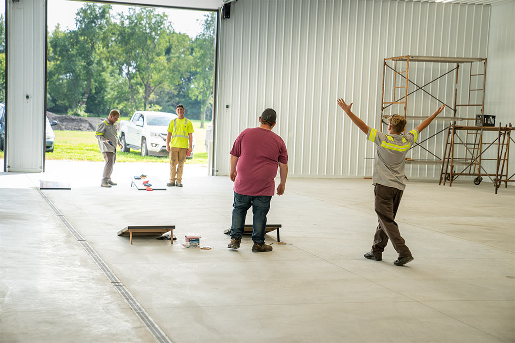 Attendees playing games at the LawnCare By Walter Open House Event